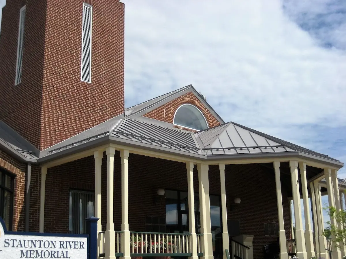 Skilled roofing craftsmen working on a residential roof in Homewood